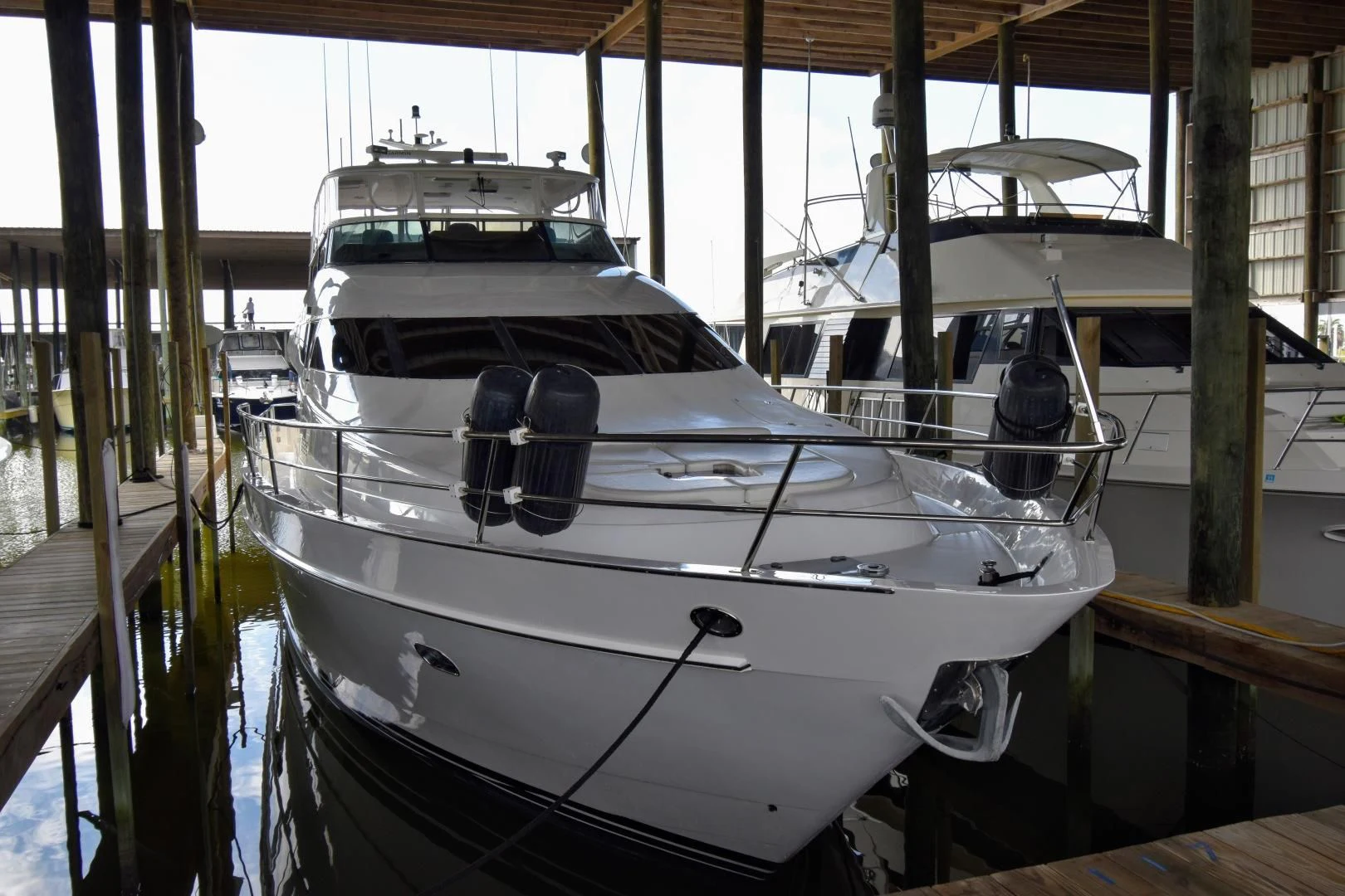 a boat docked in a harbor aboard CLEW LESS Yacht for Sale