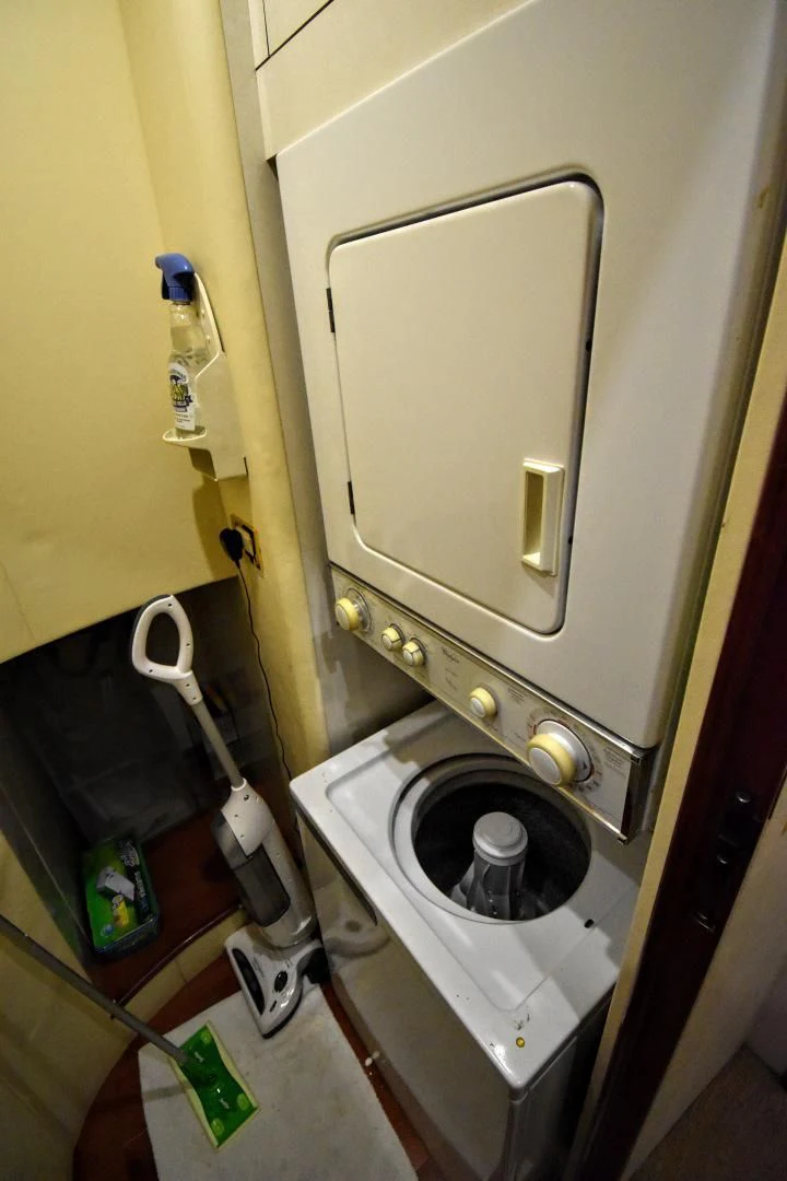 a toilet with a wooden seat aboard CLEW LESS Yacht for Sale