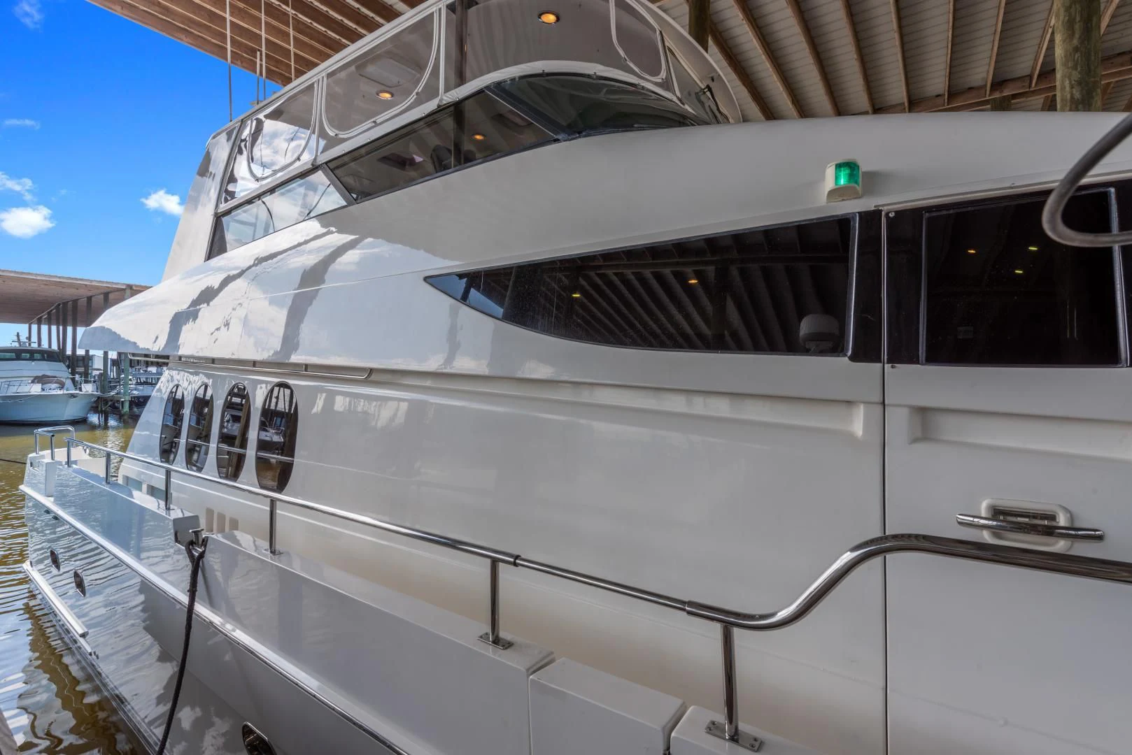 a white yacht in a dock aboard CLEW LESS Yacht for Sale