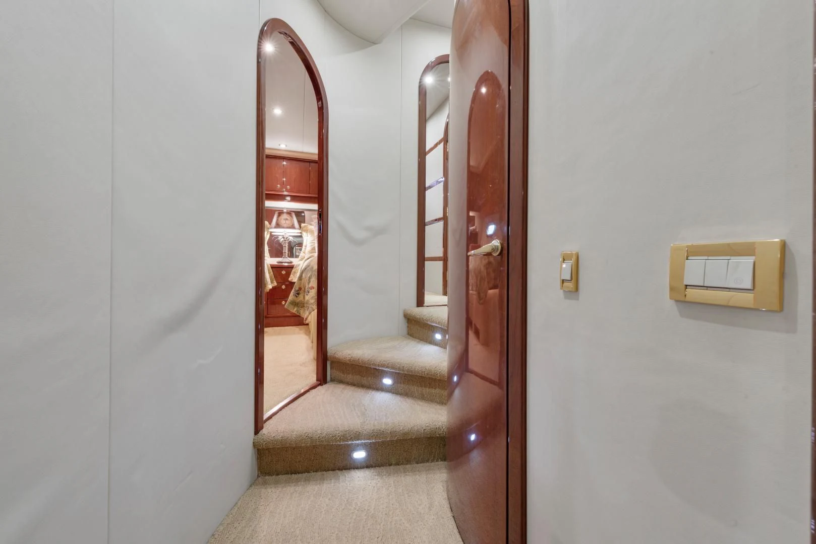 a hallway with a door and a staircase aboard CLEW LESS Yacht for Sale