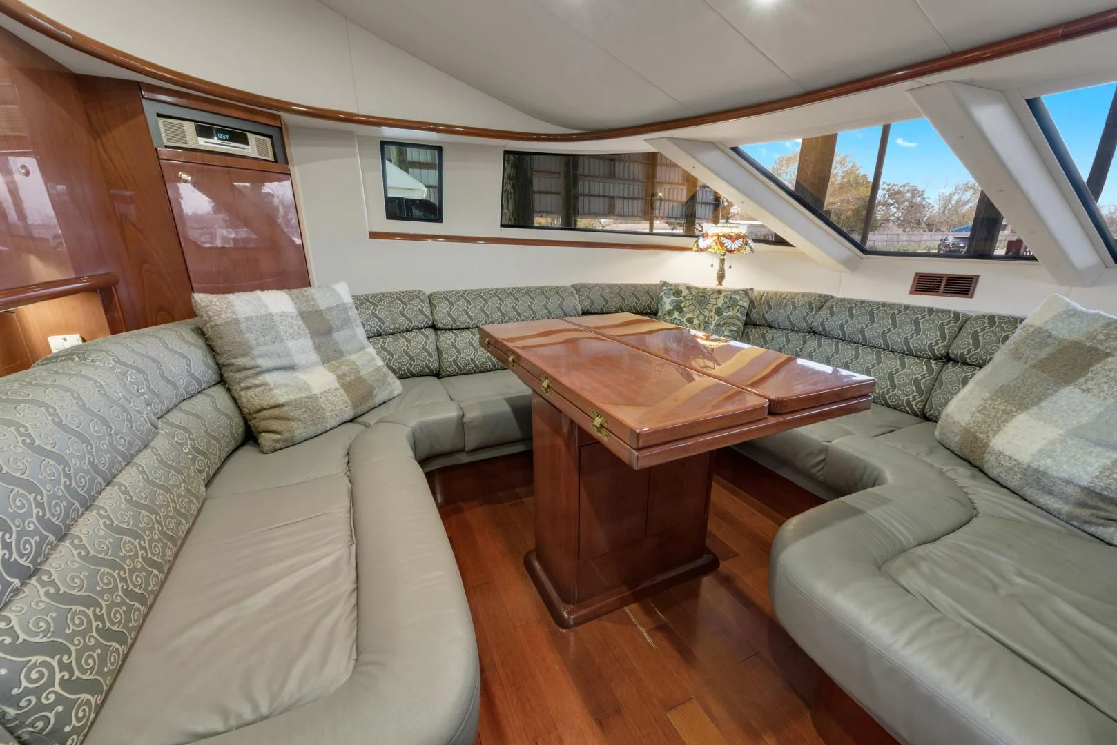 a living room with couches and a coffee table aboard CLEW LESS Yacht for Sale