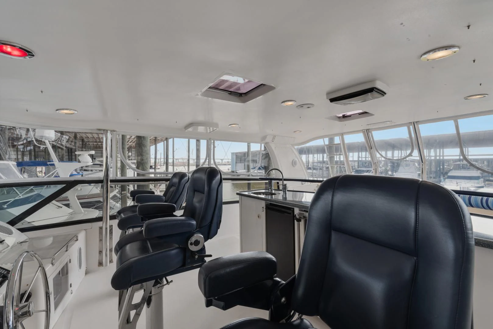 inside of a vehicle with chairs and a table and a window aboard CLEW LESS Yacht for Sale