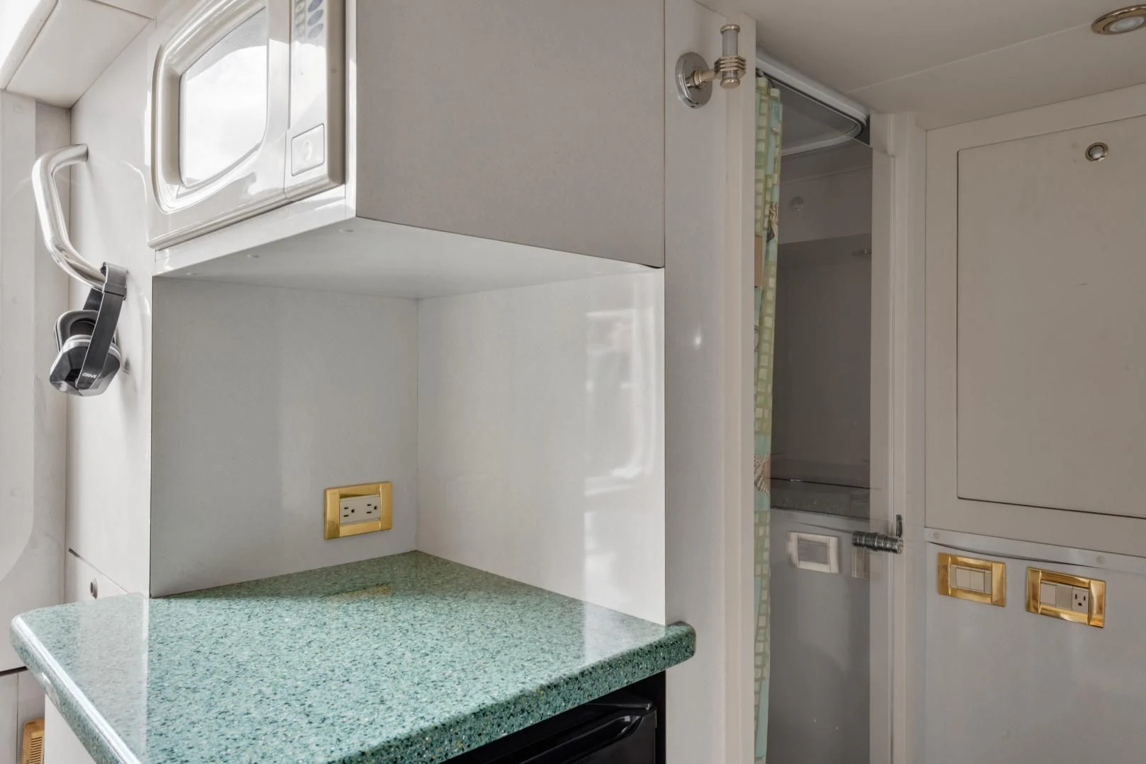 a kitchen with a blue counter aboard CLEW LESS Yacht for Sale