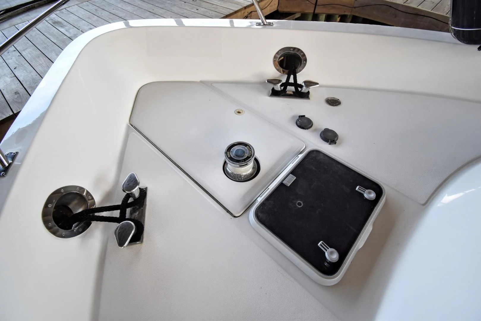 a white rectangular object with a black knob and a black object on it aboard CLEW LESS Yacht for Sale