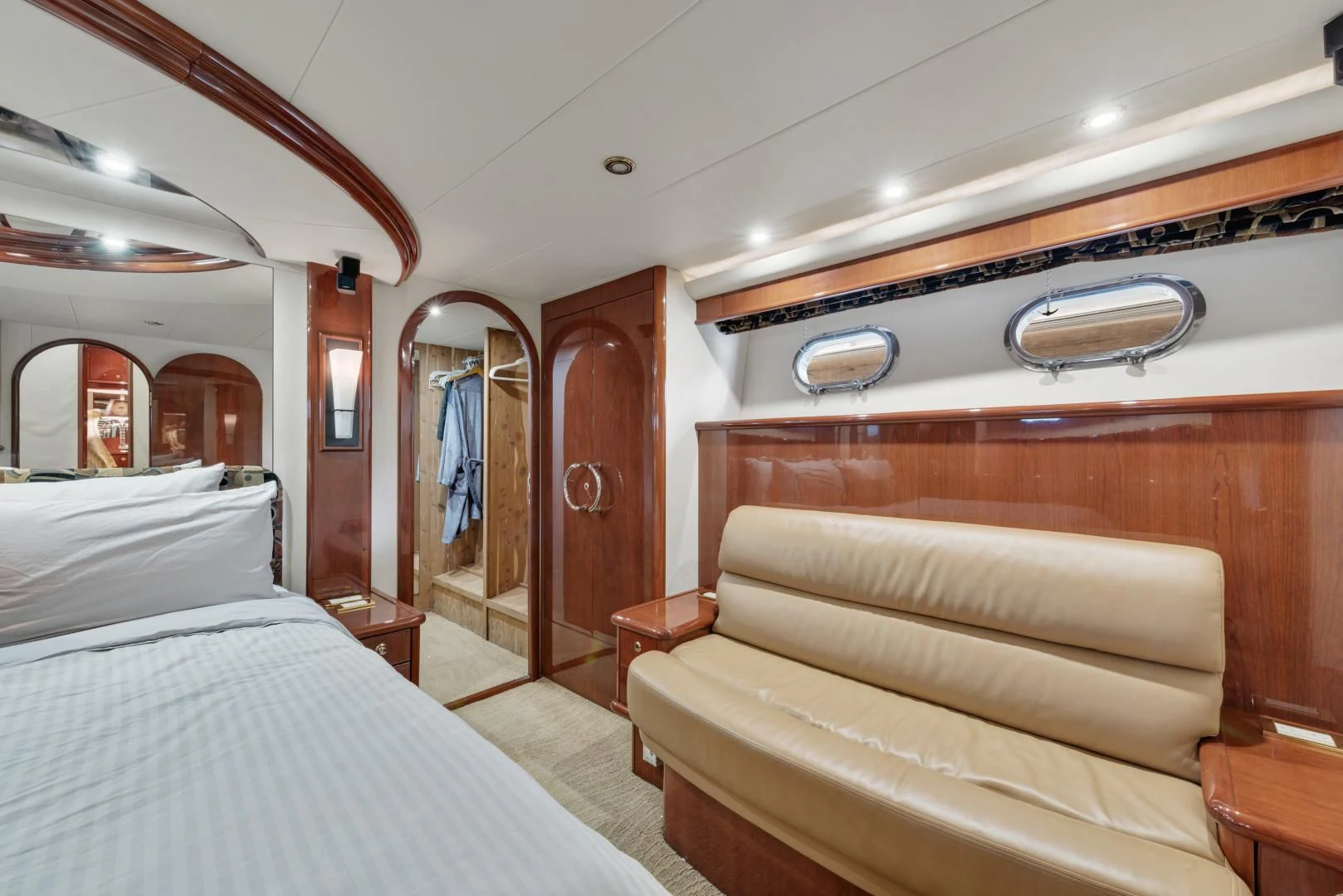 a room with a bed and a mirror aboard CLEW LESS Yacht for Sale