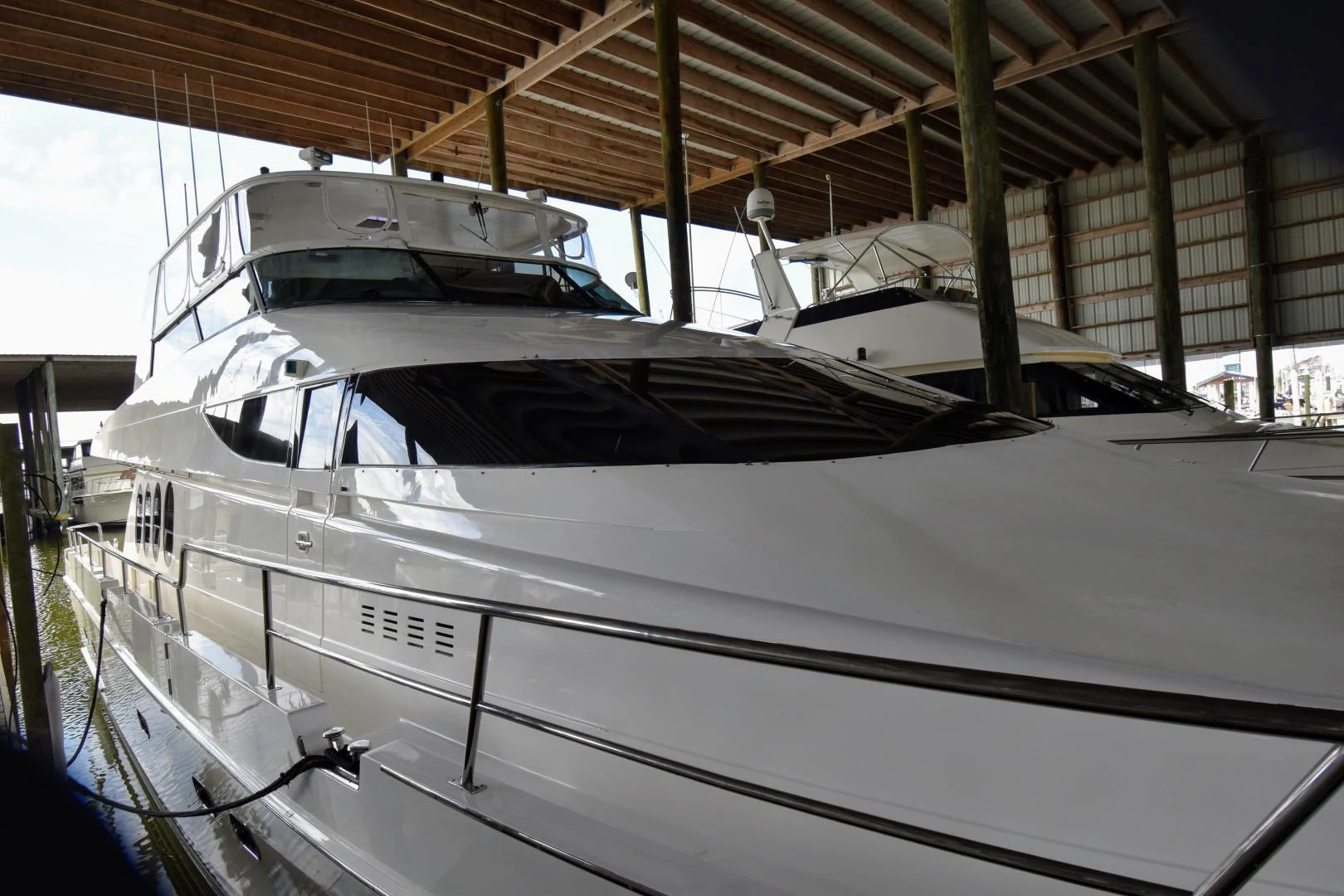 a white yacht in a large building aboard CLEW LESS Yacht for Sale