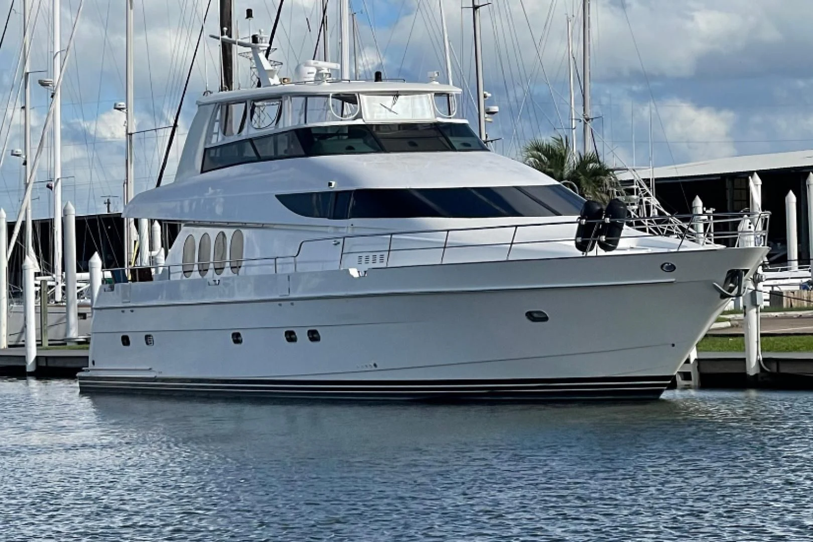 a white yacht docked aboard CLEW LESS Yacht for Sale
