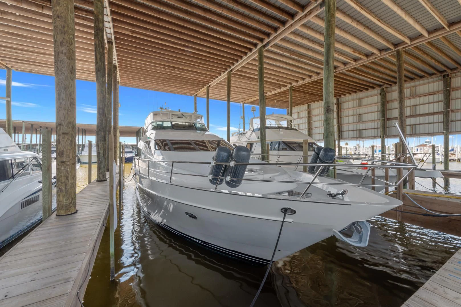 a boat docked at a pier aboard CLEW LESS Yacht for Sale