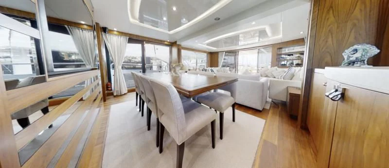 a room with a table and chairs aboard LUCKY GIRLS Yacht for Sale