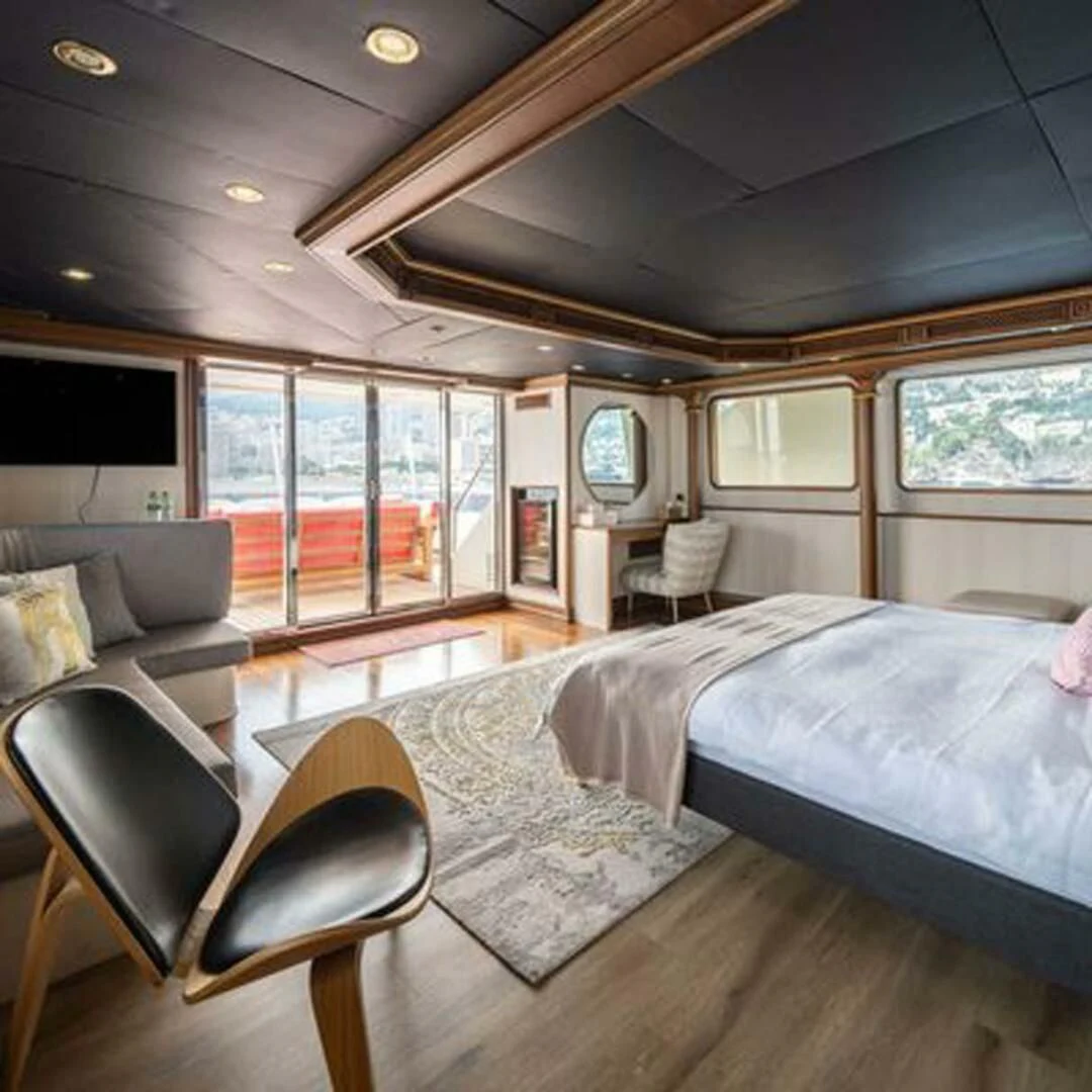 a bedroom with a large bed aboard IRAMA Yacht for Sale