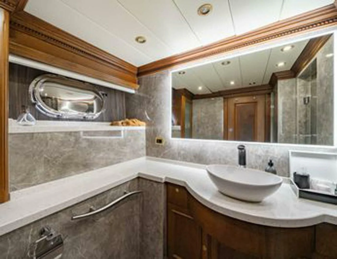 a bathroom with a large mirror aboard IRAMA Yacht for Sale