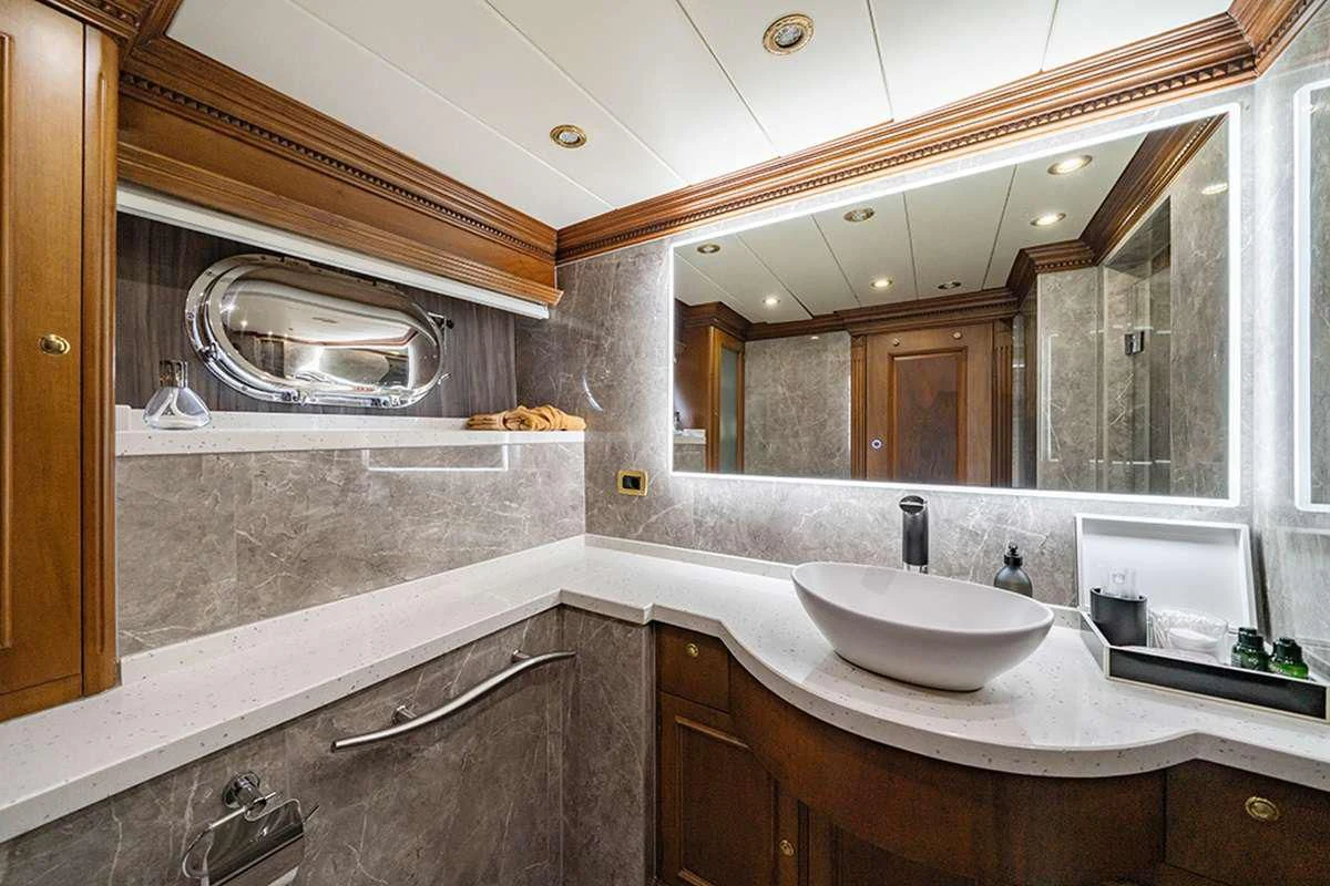 a bathroom with a large mirror aboard IRAMA Yacht for Sale