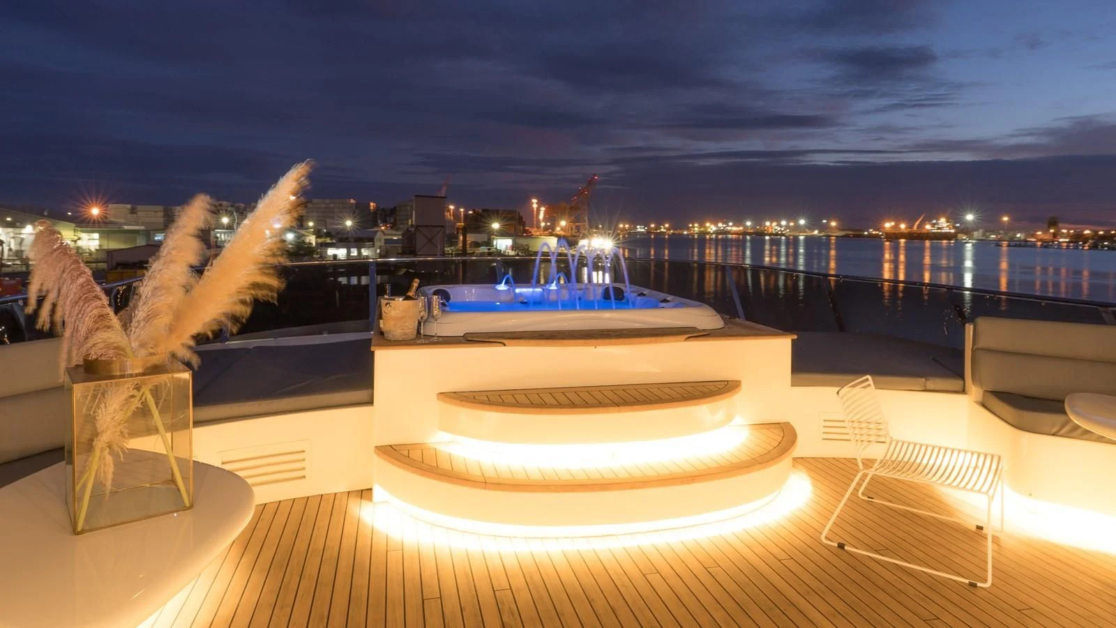 a large pool with a large statue aboard IRAMA Yacht for Sale