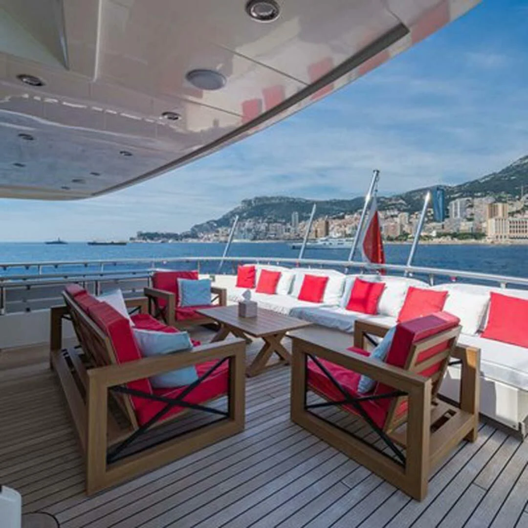 a deck with chairs and a view of a city aboard IRAMA Yacht for Sale