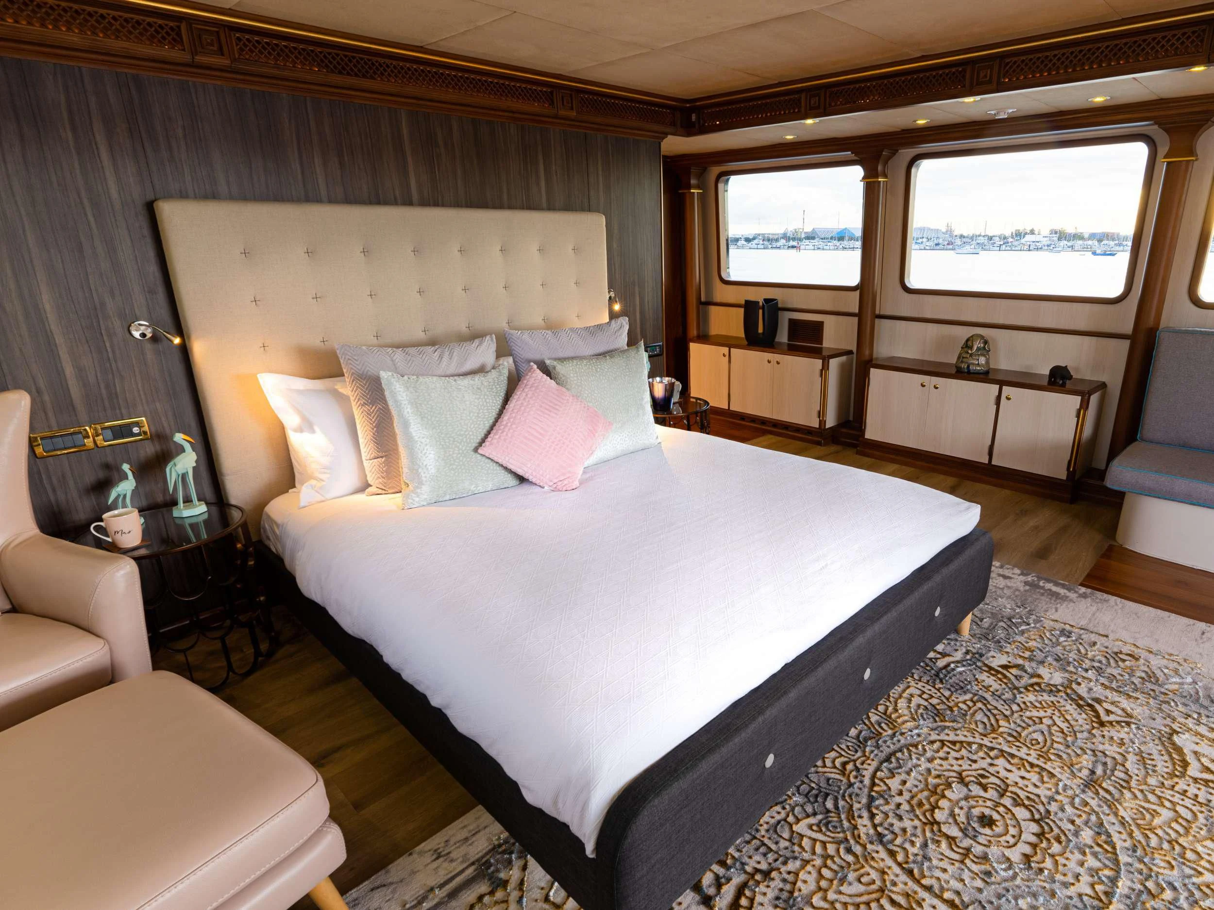 a bed with white sheets aboard IRAMA Yacht for Sale