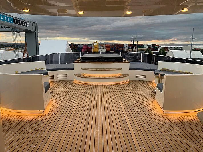 a large kitchen with a wood floor aboard IRAMA Yacht for Sale