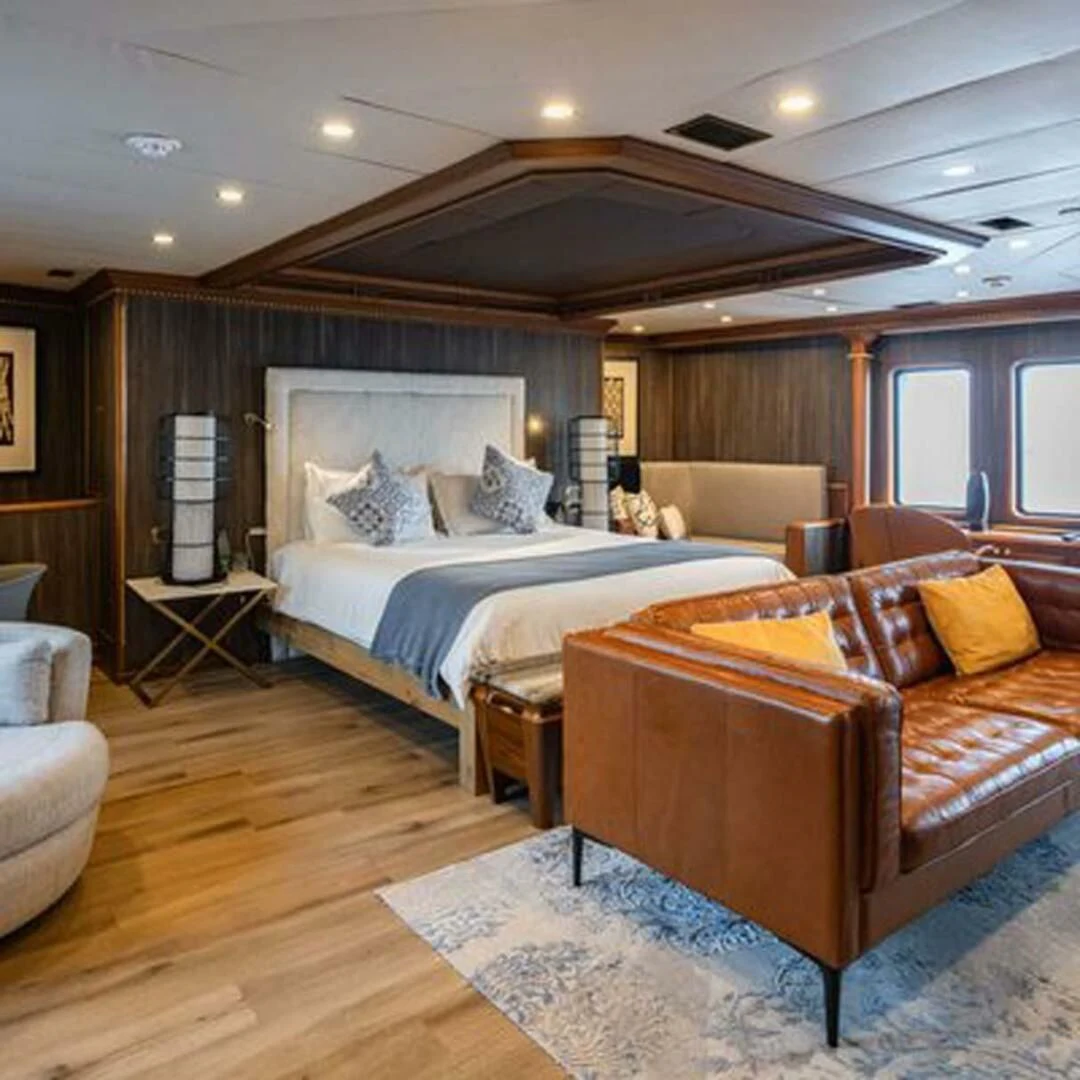 a large bedroom with a large bed aboard IRAMA Yacht for Sale