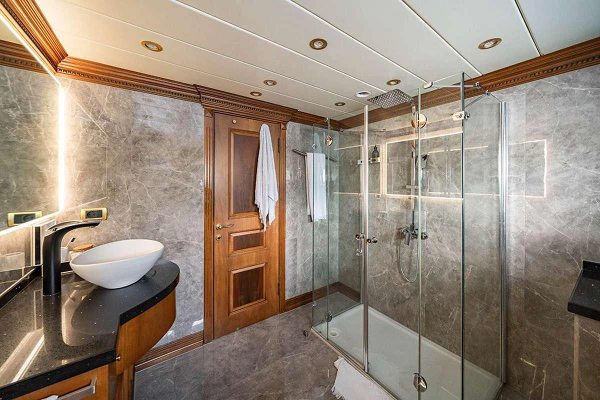 a bathroom with a sink and a shower aboard IRAMA Yacht for Sale