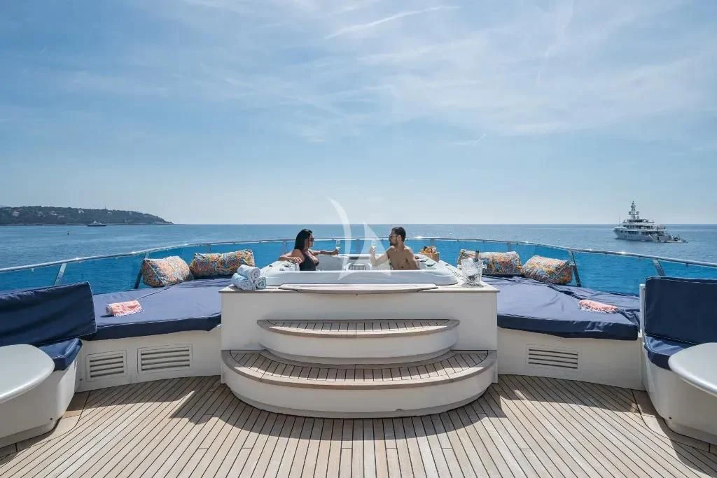 a group of people sitting on a boat aboard IRAMA Yacht for Sale