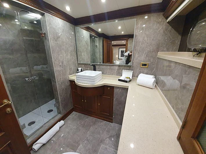 a bathroom with a large glass shower aboard IRAMA Yacht for Sale