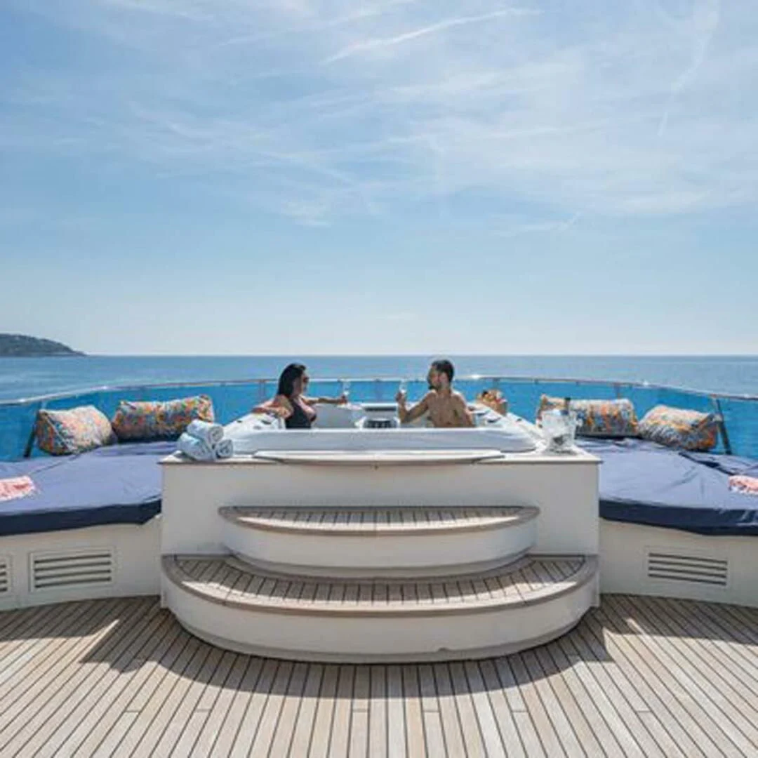 a group of people sitting on a boat aboard IRAMA Yacht for Sale
