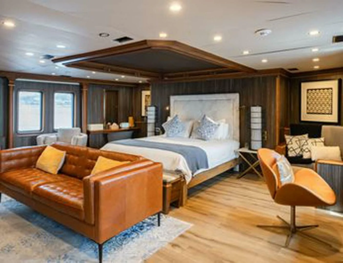 a large bedroom with a large bed aboard IRAMA Yacht for Sale
