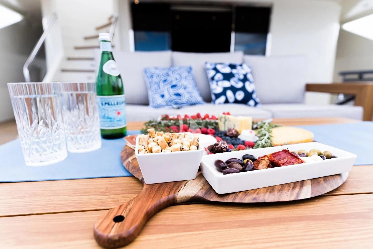 a table with food and drinks on it aboard IRAMA Yacht for Sale