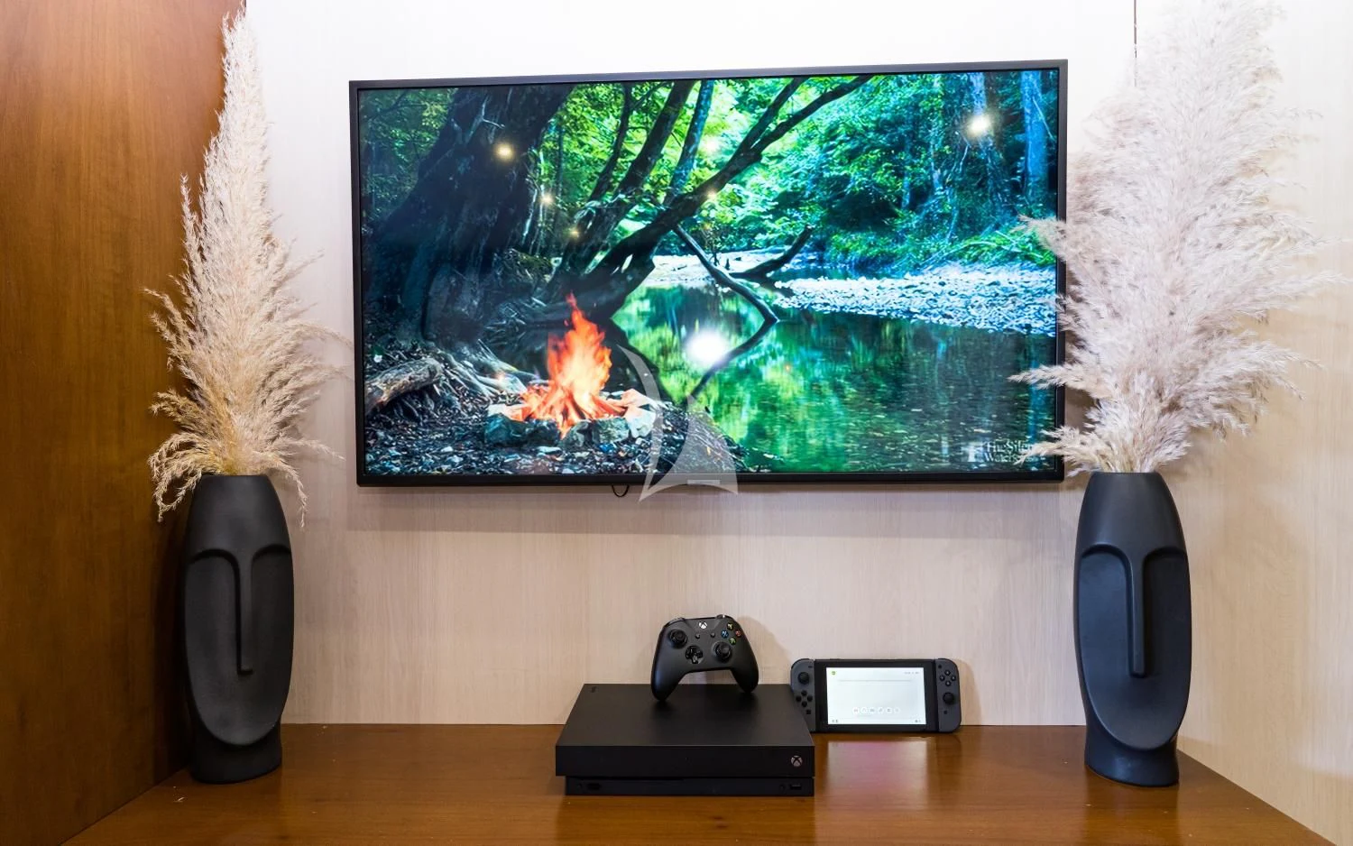 a tv and a gaming controller on a table aboard IRAMA Yacht for Sale