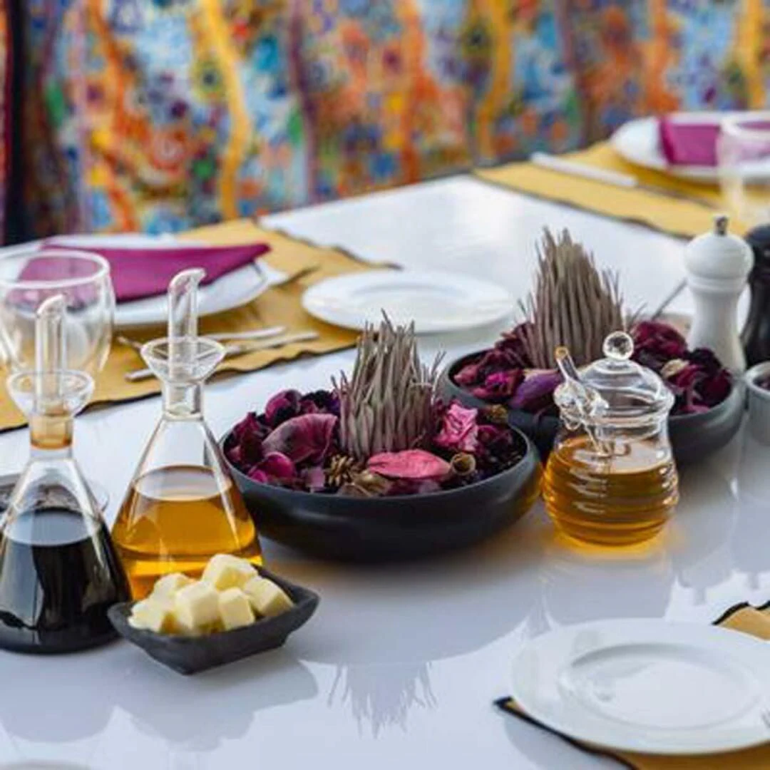 a table with food and drinks aboard IRAMA Yacht for Sale