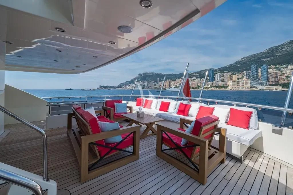 a deck with chairs on it aboard IRAMA Yacht for Sale