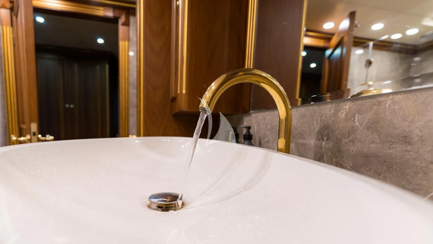 a bathroom sink with a mirror aboard IRAMA Yacht for Sale
