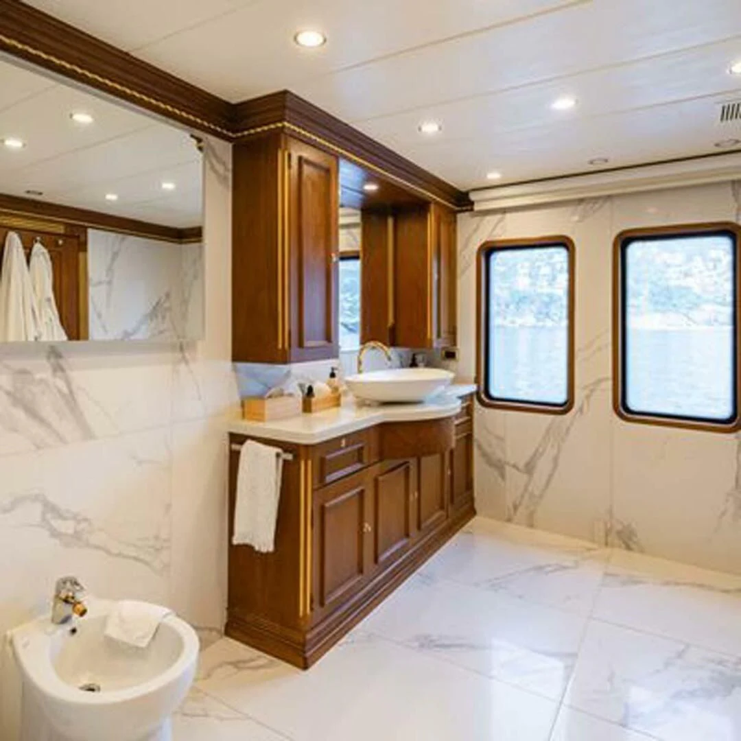 a bathroom with a sink and a mirror aboard IRAMA Yacht for Sale