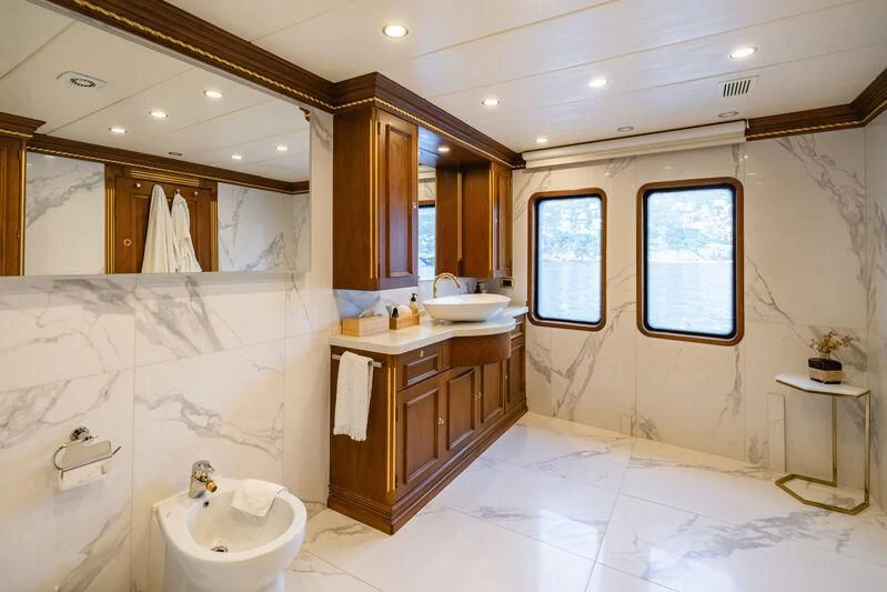 a bathroom with a sink and a mirror aboard IRAMA Yacht for Sale