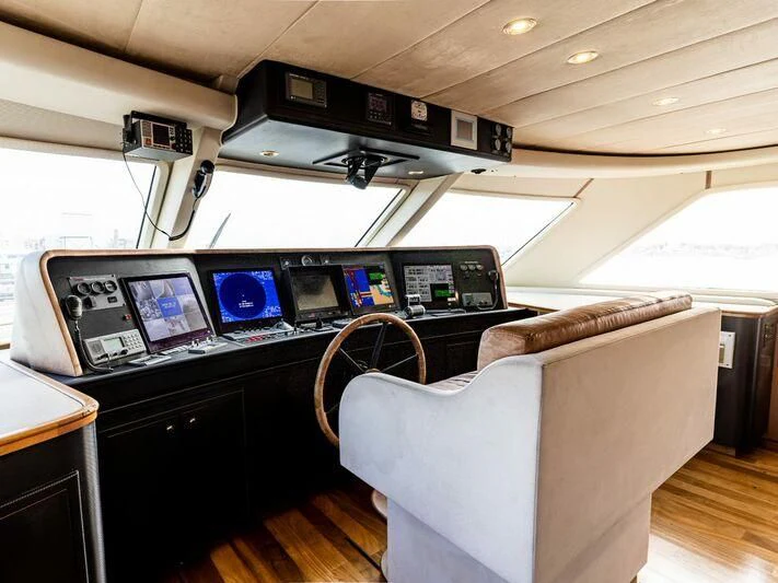 a room with a desk and computer aboard IRAMA Yacht for Sale