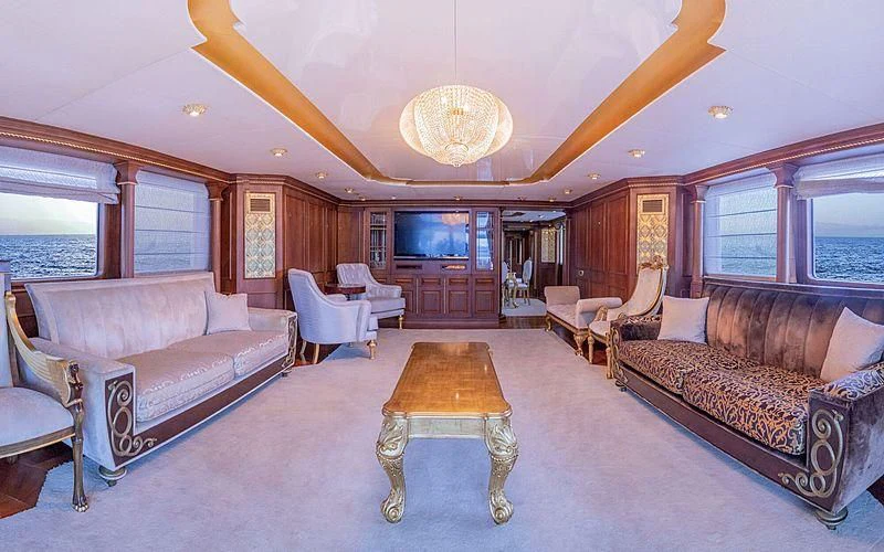 a living room with a couch and a table aboard IRAMA Yacht for Sale