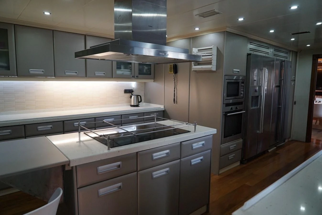 a kitchen with stainless steel appliances aboard IRAMA Yacht for Sale