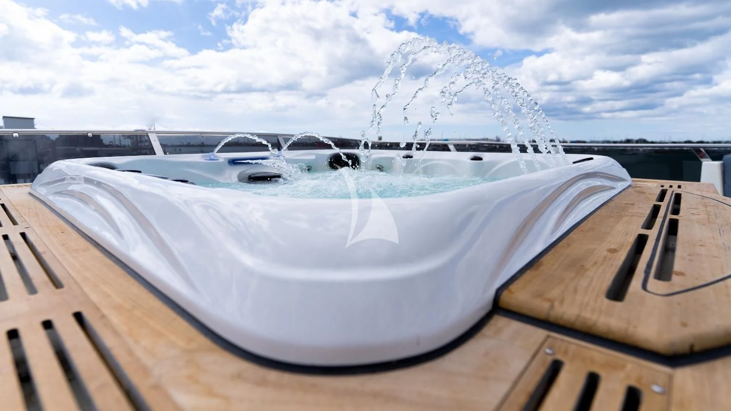 a large white pool aboard IRAMA Yacht for Sale