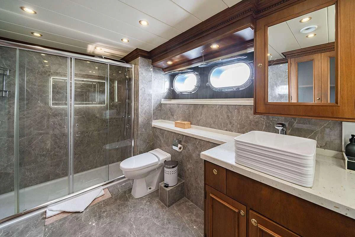 a bathroom with a glass shower aboard IRAMA Yacht for Sale