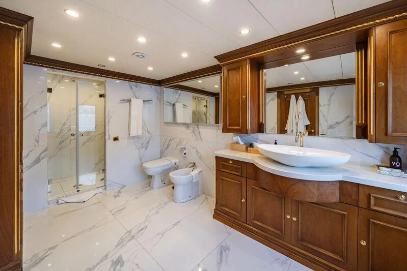a bathroom with a large mirror aboard IRAMA Yacht for Sale