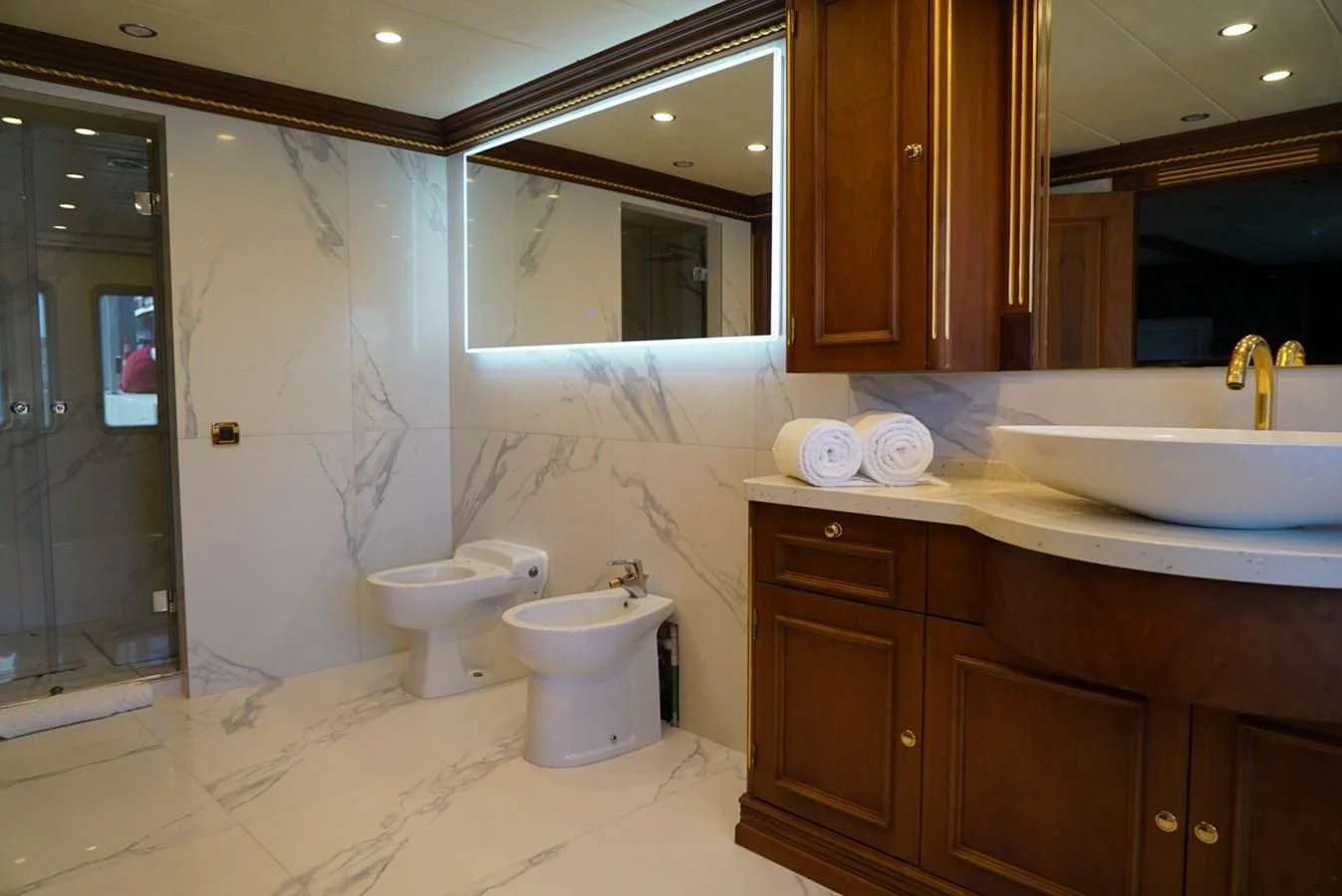 a bathroom with a sink and a toilet aboard IRAMA Yacht for Sale