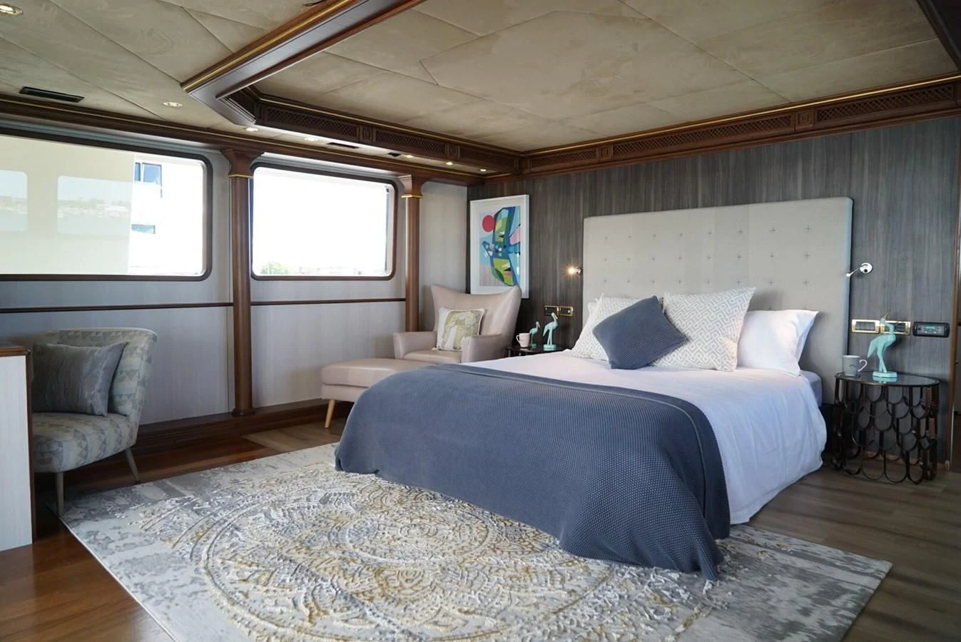 a large bedroom with a large bed aboard IRAMA Yacht for Sale
