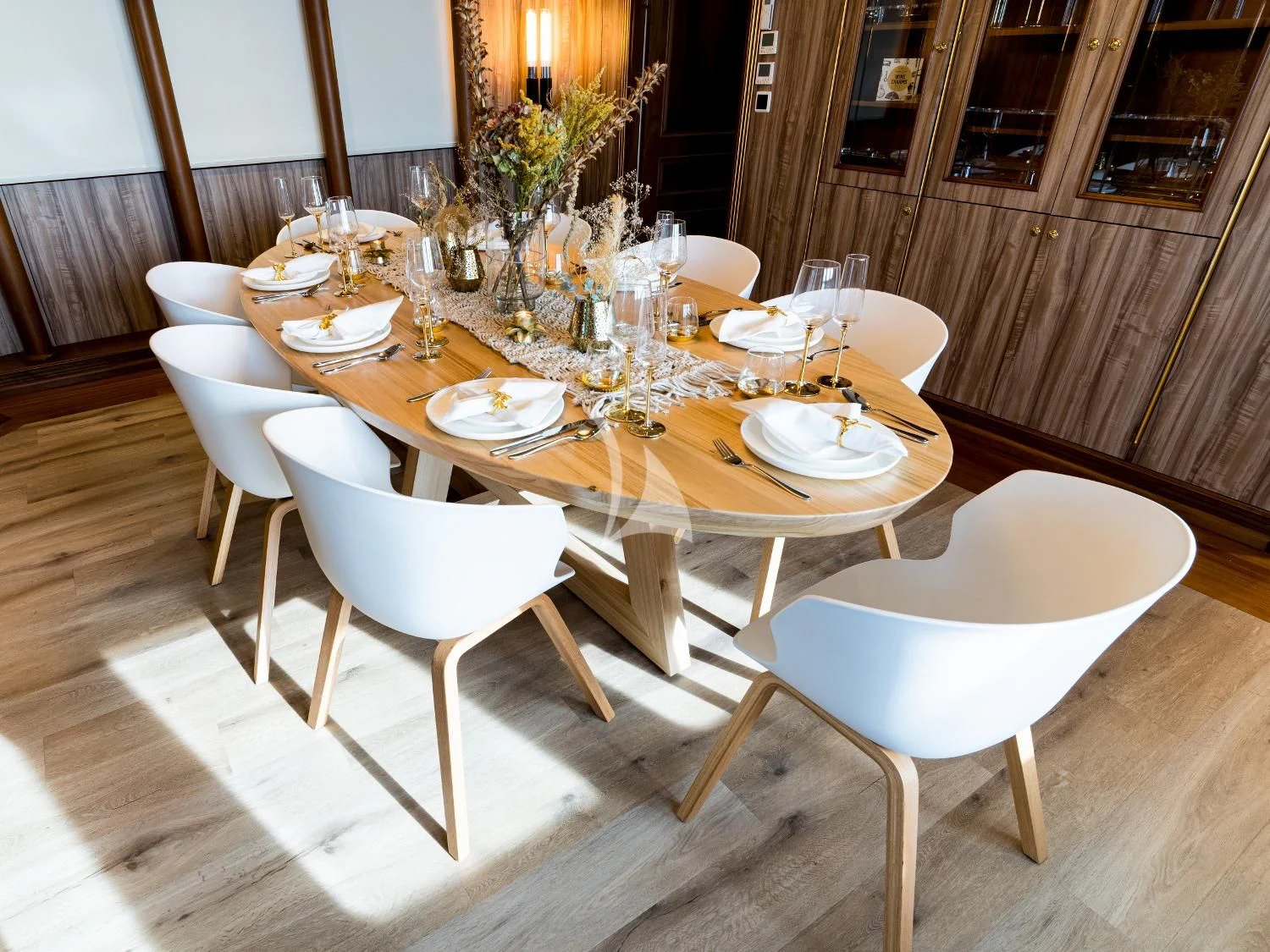 a table set with plates and silverware aboard IRAMA Yacht for Sale