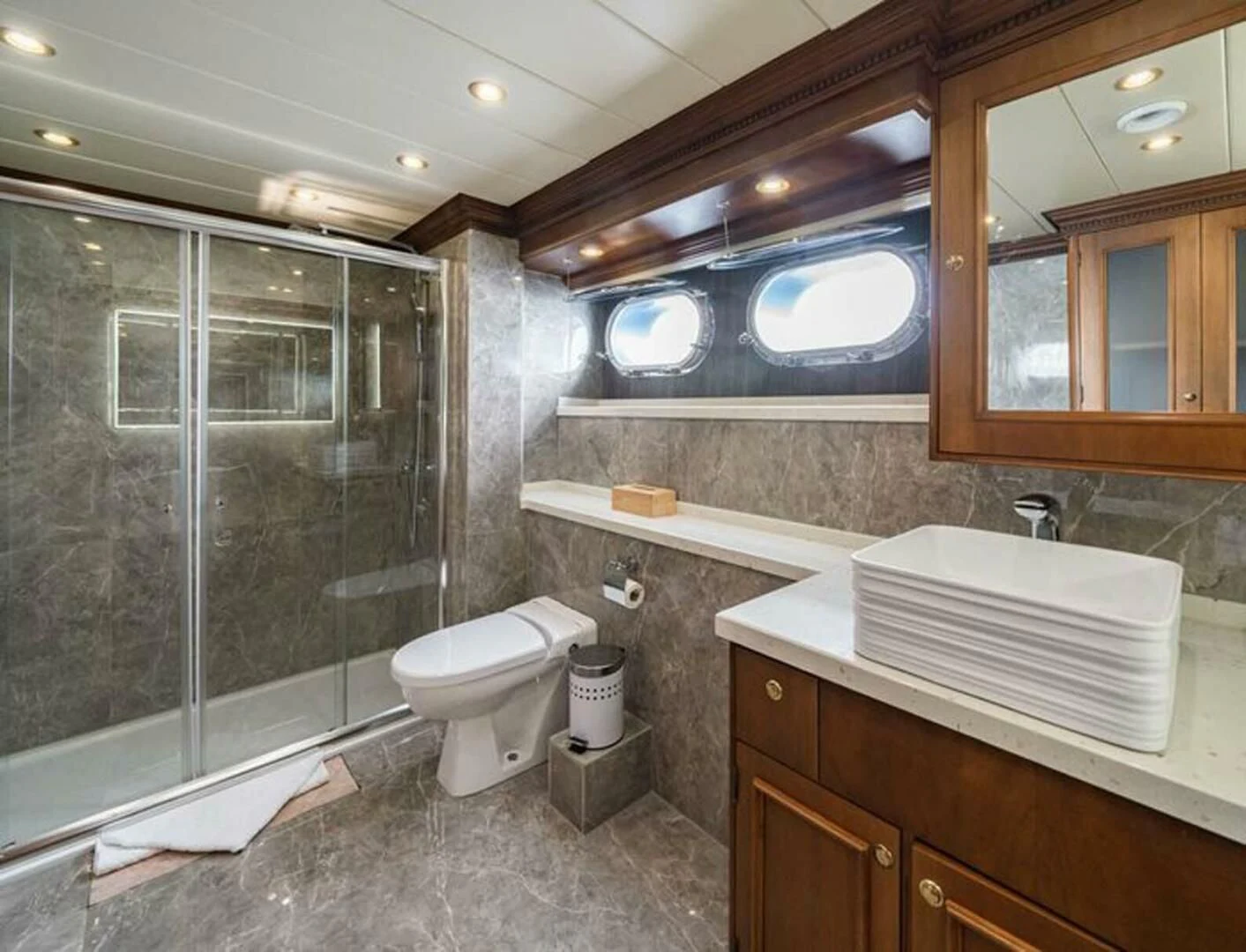 a bathroom with a glass shower aboard IRAMA Yacht for Sale