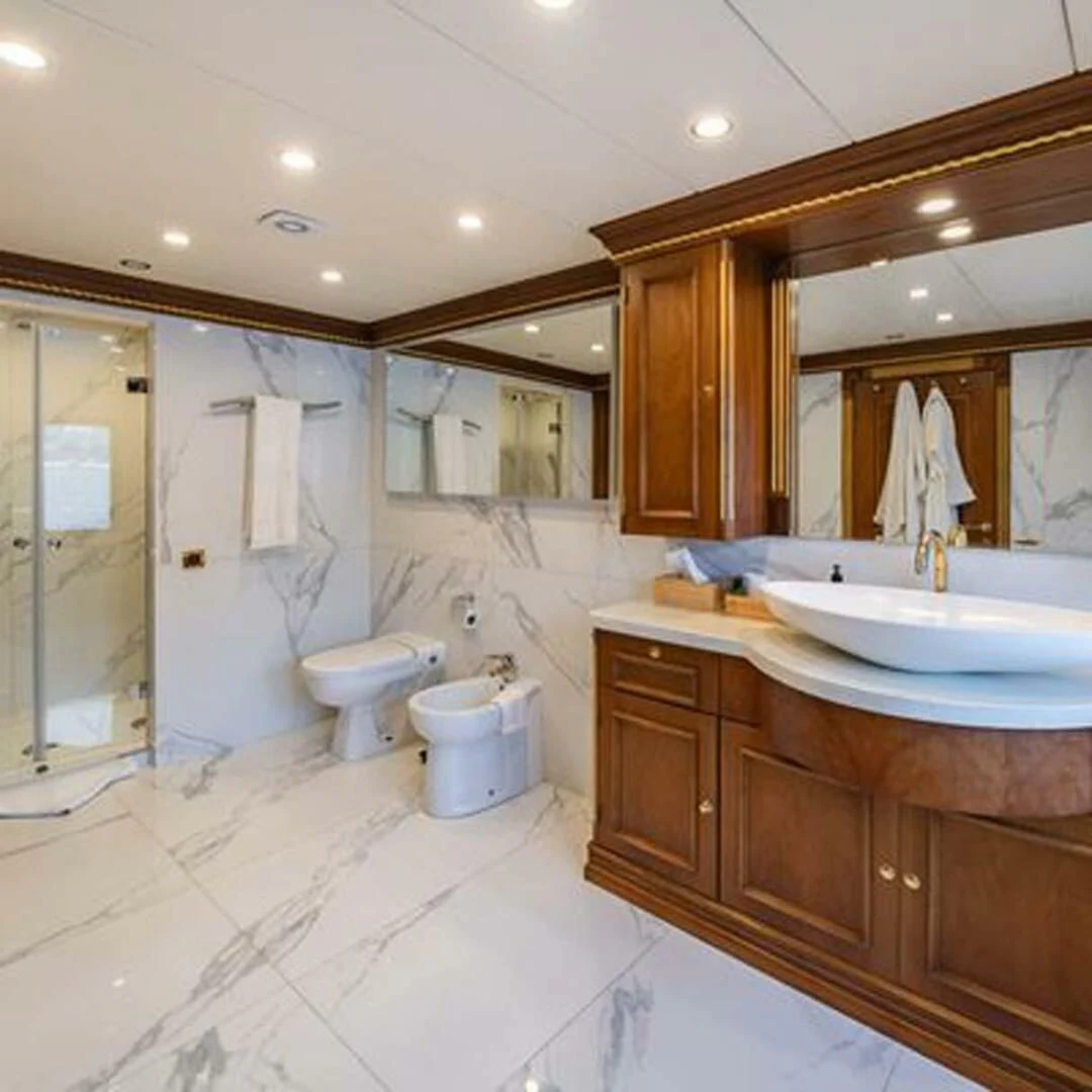 a bathroom with a large mirror aboard IRAMA Yacht for Sale