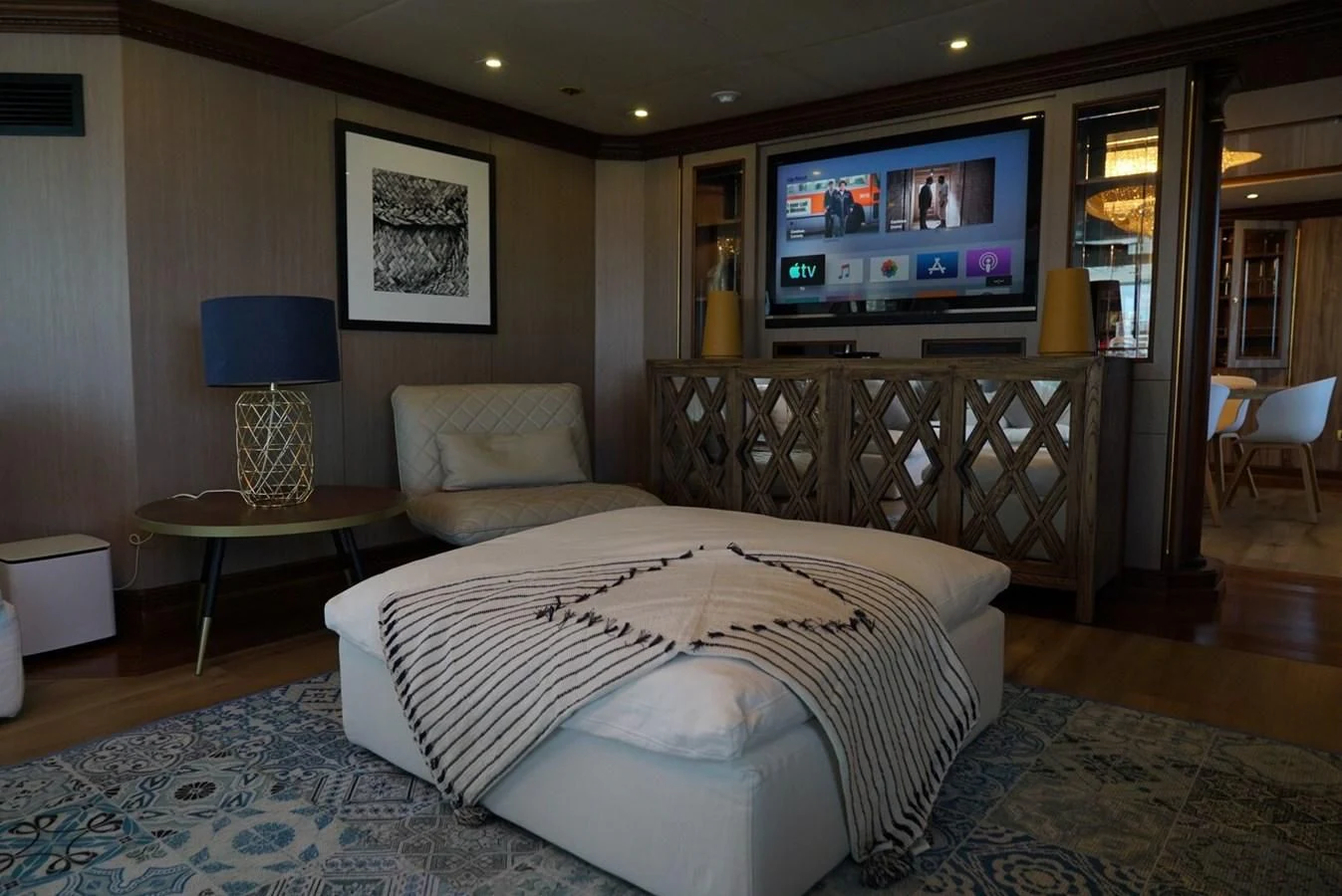a hotel room with a large bed aboard IRAMA Yacht for Sale