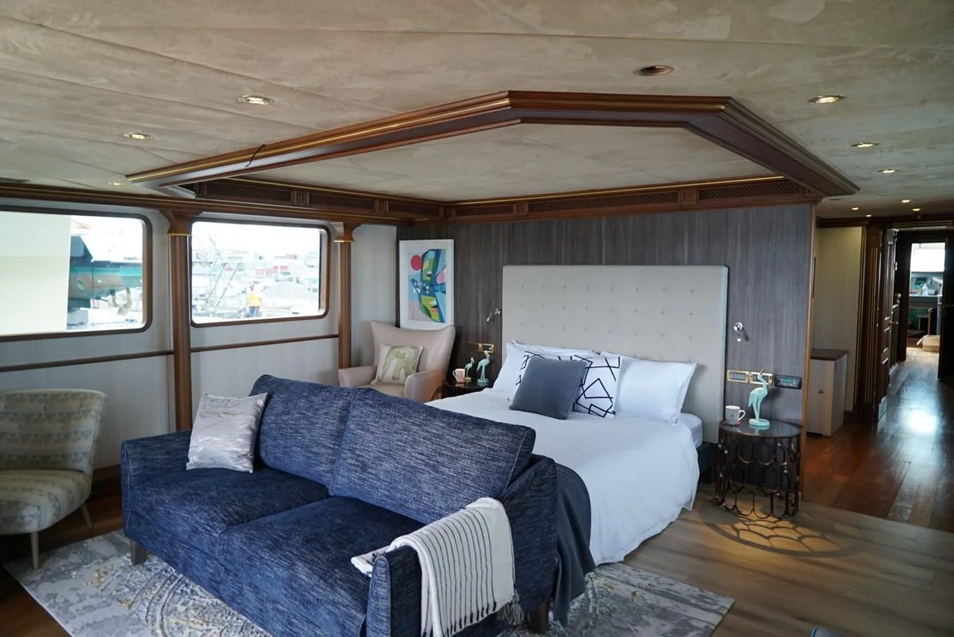a large bed in a room aboard IRAMA Yacht for Sale
