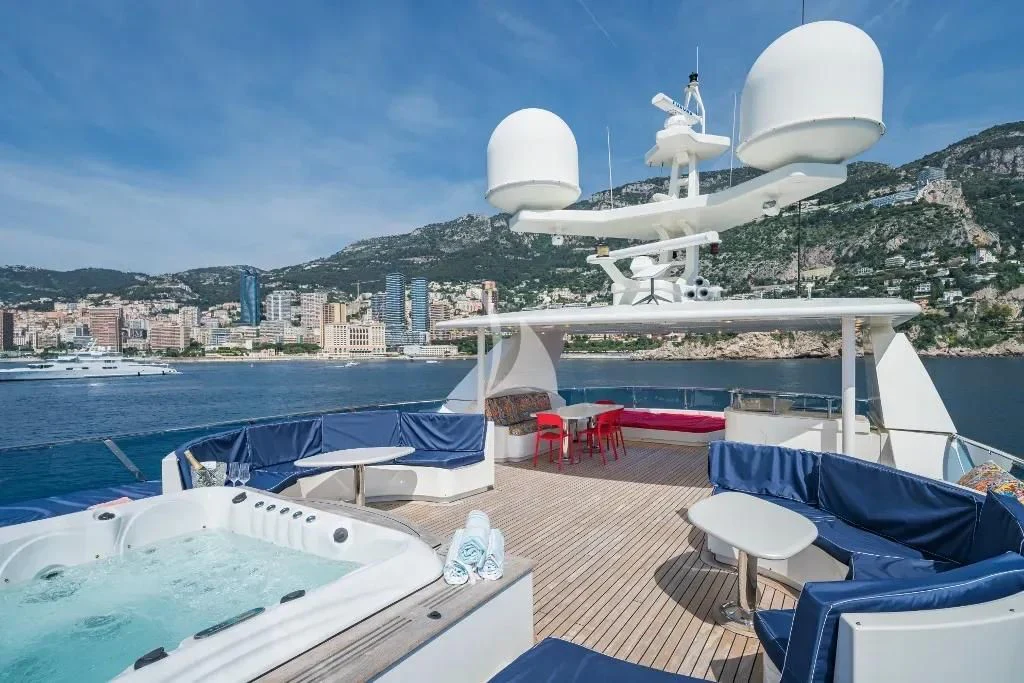 a deck with a large white building and a large white building with a dome on top of it aboard IRAMA Yacht for Sale