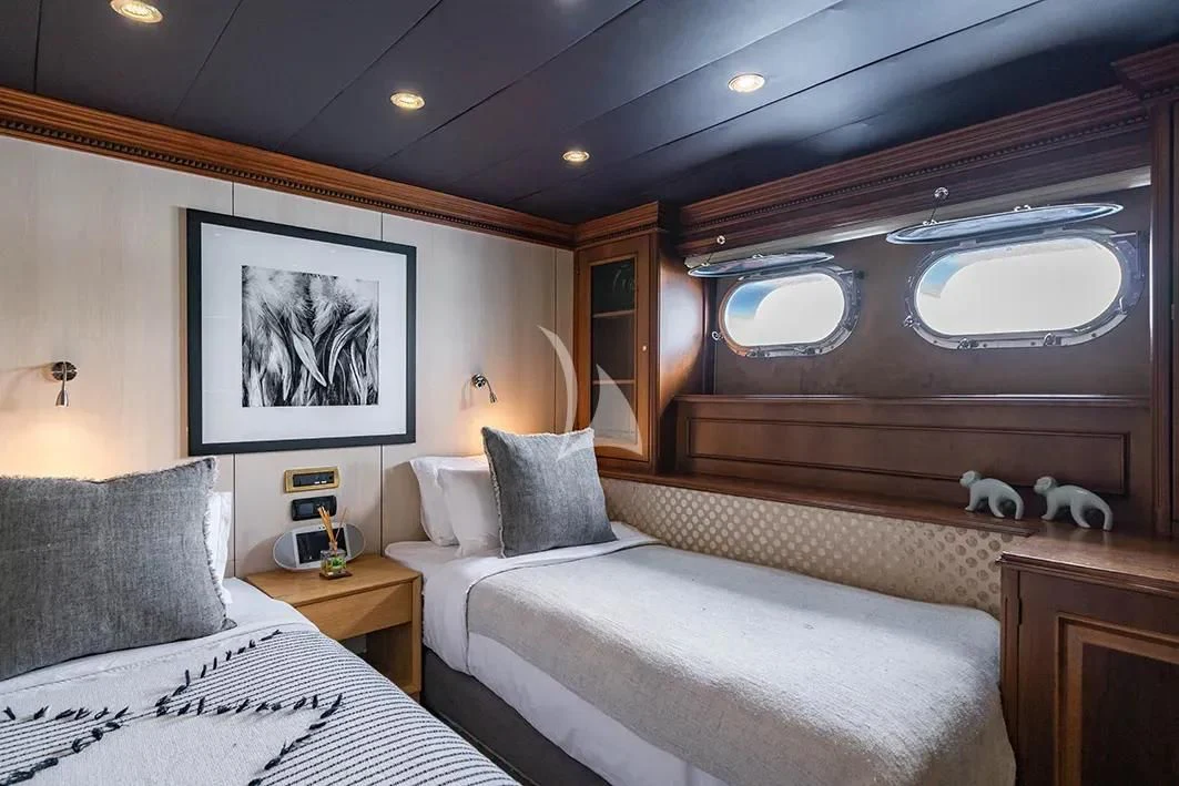 a room with two beds aboard IRAMA Yacht for Sale