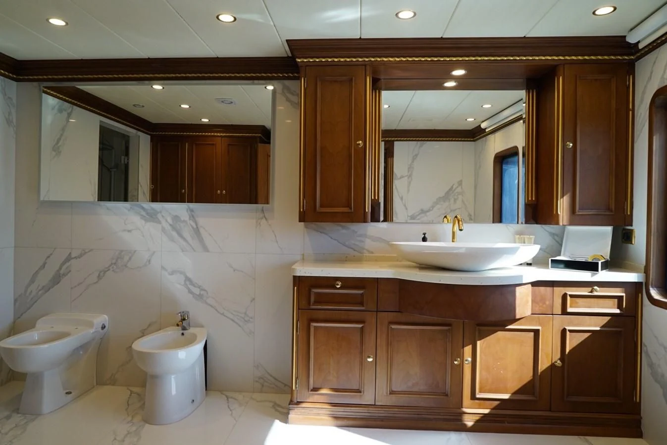 a bathroom with a large mirror aboard IRAMA Yacht for Sale
