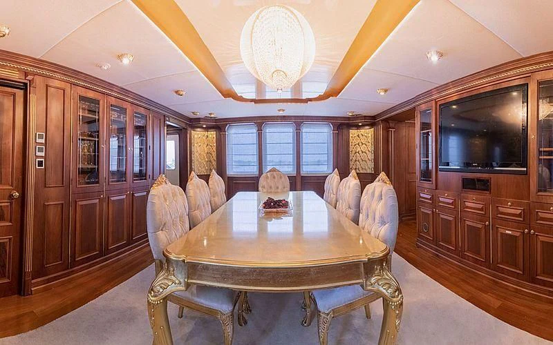 a dining table in a kitchen aboard IRAMA Yacht for Sale